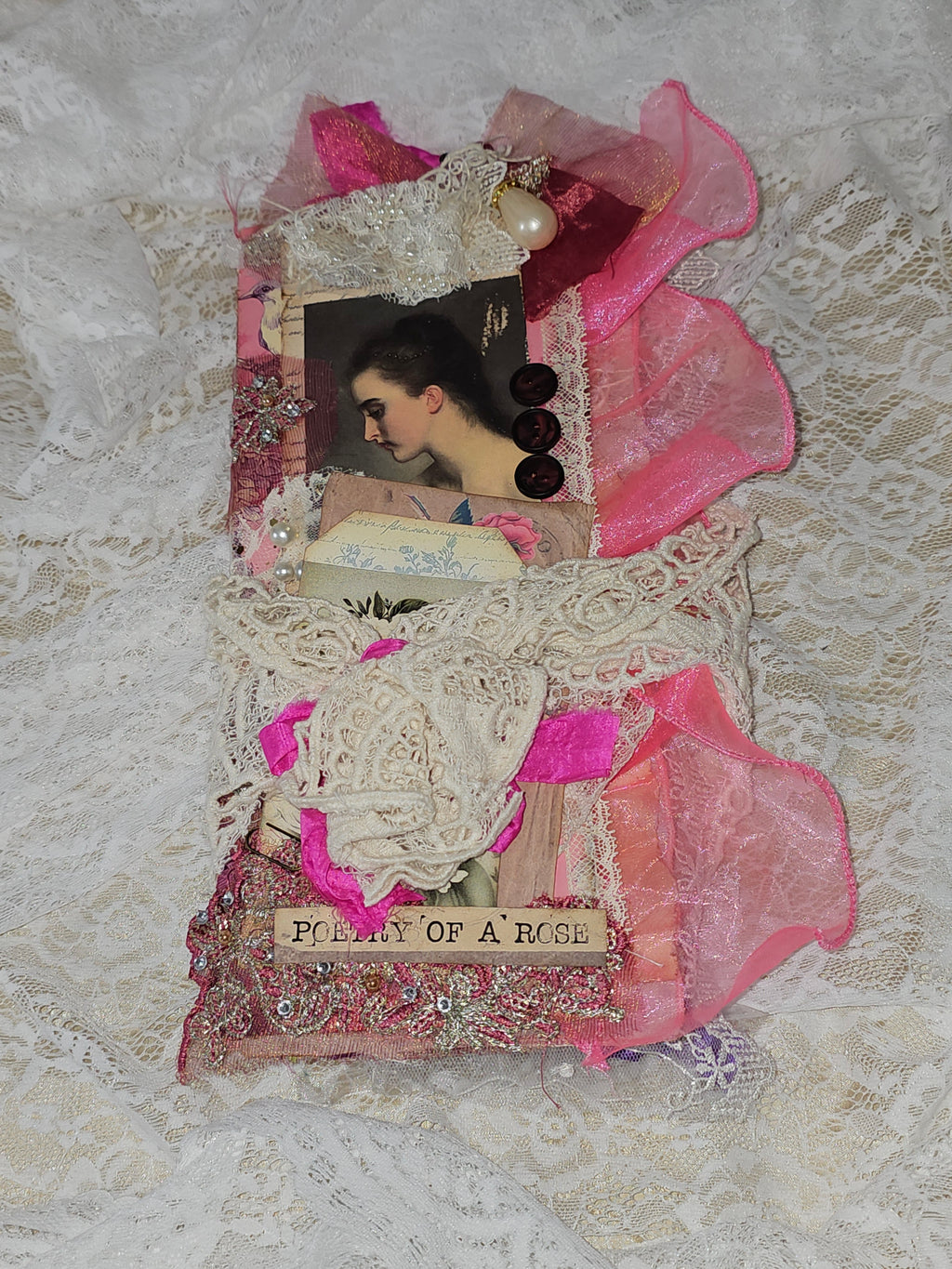 Artistic collage with pink and white elements on a textured background